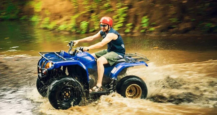 Atv Quad Bike Through Tunnel And Waterfall In Bali